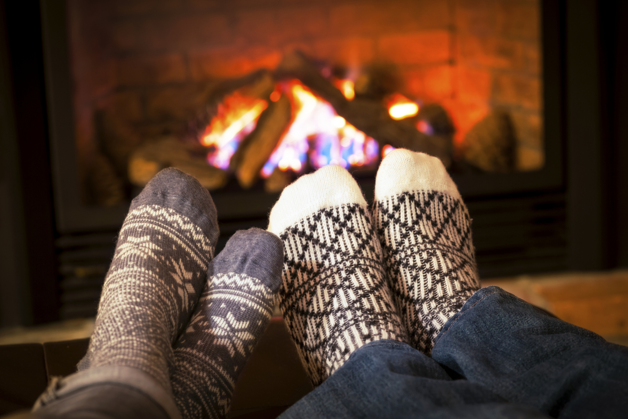3 of the Best Christmas Destinations Home feet up by the fire