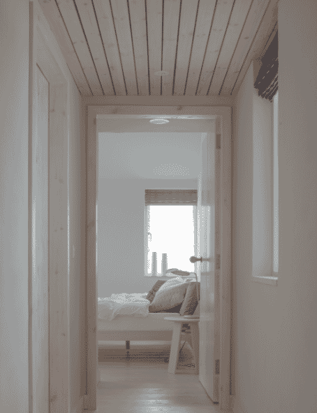 Lochside House pale wood clad corridor, looking towards bedroom, RIBA Awards 2018