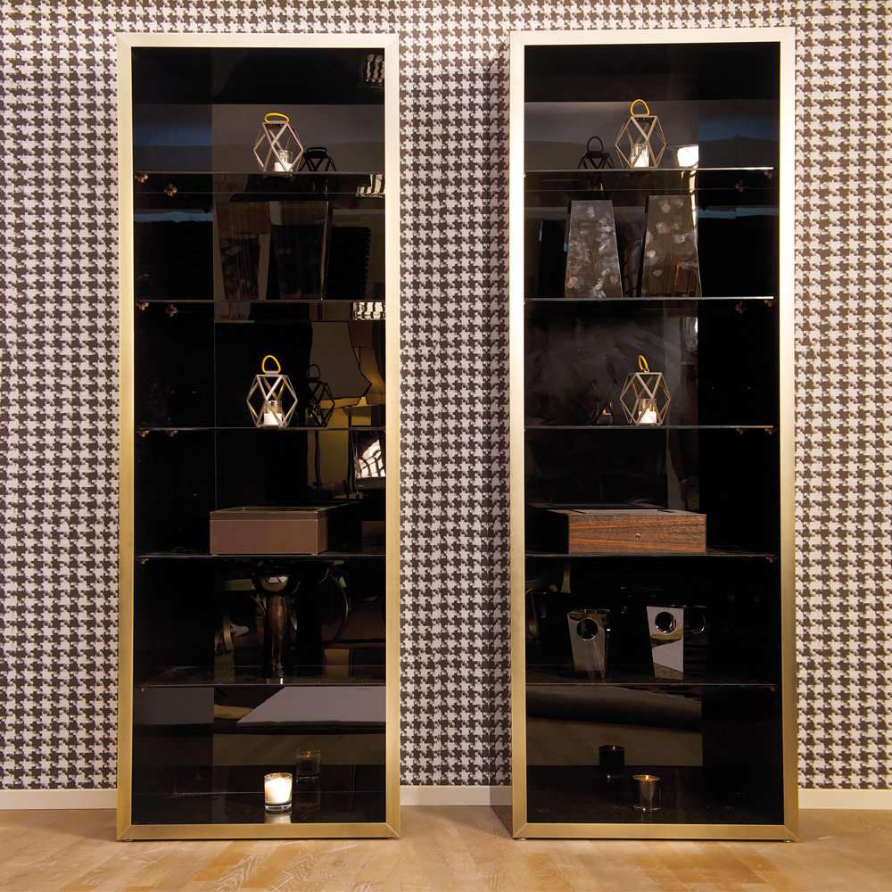 Luxury products on display in glass cabinets outside Louis Vuitton