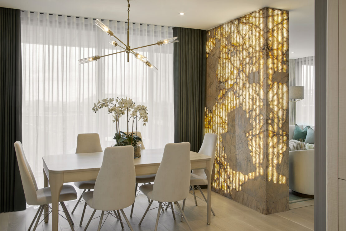 Luxury dining room, with feature wall and dining table plus modern chandelier