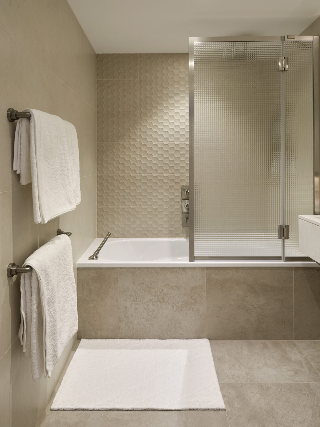 Luxury bath in bathroom in an apartment in Battersea London designed by Juliettes Interiors